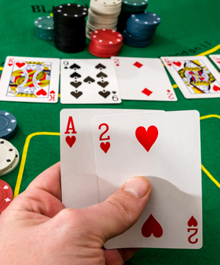 chips and 2 cards on red table