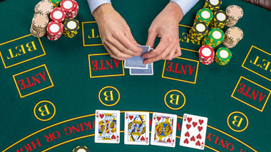 hands holding card with chips