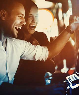 two people playing slots