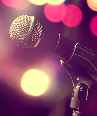 microphone with faded lights and purple background
