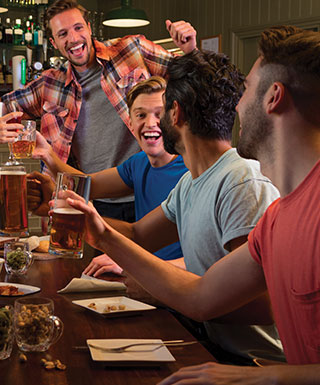 Friends celebrate at o.h. sports bar