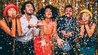 new years eve confetti falling on celebrators