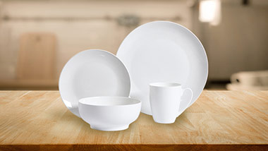 Plates, bowl and cup on kitchen counter