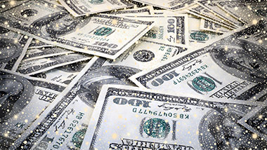 Pile of cash with stars in the foreground