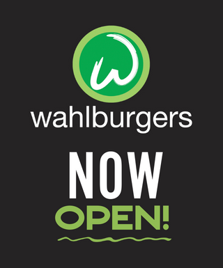 Wahlburgers logo with NOW OPEN text