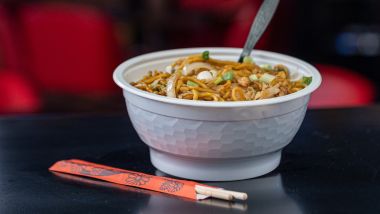 Lo mein dish with chopsticks