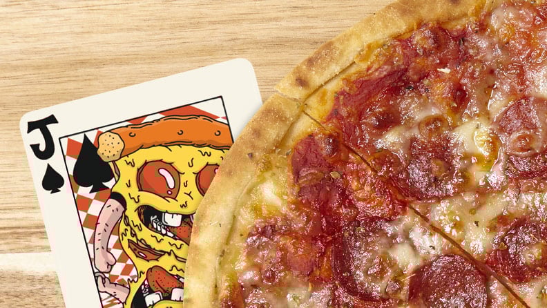 large pepperoni pizza with Pizzaface card underneath it