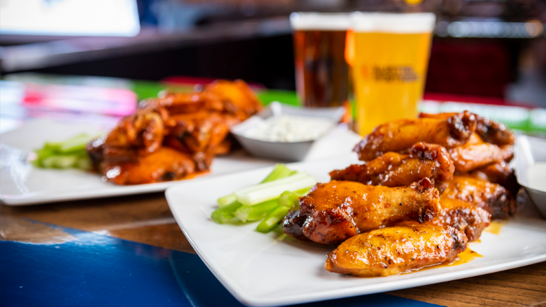 Chicken wings and beer at Barstool Sportsbook